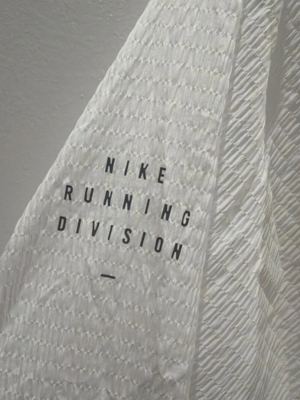 Nike white cover jacket with subtle textured pattern